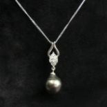 9 carat white gold tinted pearl and diamond pendant and chain, 2.4 grams. Chain 47 cm, pendant 26 mm