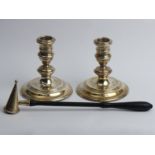 A pair of Elizabeth II silver candlesticks, London 1961 and a silver and wooden handled snuffer,