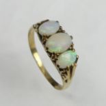 9 carat gold opal three stone ring. Size N 1/2, 7.9 mm wide. UK Postage £12.