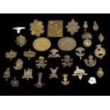 A collection of un-collated military cap badges (29). UK Postage £12.