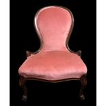 A Victorian spoon back upholstered nursing chair on cabriolet legs. Collection only.