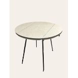 1960's melamine topped drop flap table. 90 cm diameter. Collection only.