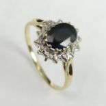 9 carat gold sapphire and diamond ring, 2.3 grams. Size R, 12.3 mm wide. UK Postage £12.