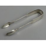 A pair of Victorian silver sugar tongs, Newcastle 1873, 36 grams. 14 cm.