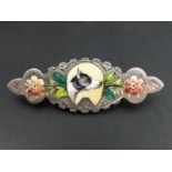 Late Victorian silver and enamel dog and flower scene design brooch, 3.4 grams. 4.5 cm wide. UK