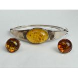 Sterling silver and amber bracelet and a pair of matching earrings, 23.4 grams. UK Postage £12.