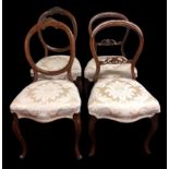 A Victorian harlequin set of four walnut balloon back dining chairs on cabriolet legs. Collection