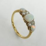 18 carat gold opal and diamond ring, 2 grams. Size M 1/2, 7.2 grams. UK Postage £12.