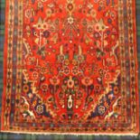 Red ground hand woven, Persian Sarouk runner with a floral design. 293 x 111 cm. UK Postage £30.