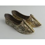 A pair of 900 silver Oriental shoes, 167 grams. 14 cm in length. UK postage £12.