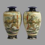 A pair of Japanese satsuma warrior scene pottery vases, circa 1920. 18 cm. UK Postage £12.