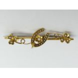 Edwardian 15 carat gold and seed pearl horseshoe and flower design brooch, 3.1 grams. 44 mm. UK