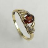 9 carat gold garnet and diamond ring, 1.8 grams. Size Q, 6.2 mm. UK Postage £12.