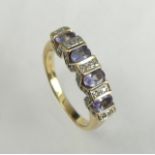 14 carat gold tanzanite and diamond ring, 3.4 grams. Size L, 4.5 mm wide. UK Postage £12.