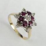 9 carat gold ruby and diamond cluster ring, 3.8 grams. Size R, 14 mm wide. UK Postage £12.