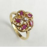 14 carat gold ruby and diamond ring, 3.2 grams. Size O, 12.9 mm wide. UK Postage £12.