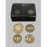 Four Japanese Tsuba's in a lacquer ware hinged box. Box 175 x 145 x 62 mm. UK Postage £15.
