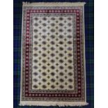 Ivory ground Kashmir traditional Bokhara design rug. 190 x 140 cm. UK Postage £20.