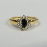 18ct gold sapphire and diamond ring, 3 grams. Size O 1/2, 9.6 mm wide. UK Postage £12.