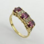 18ct gold garnet and diamond ring, 4.6 grams. Size O, 6.6 grams. UK Postage £12.