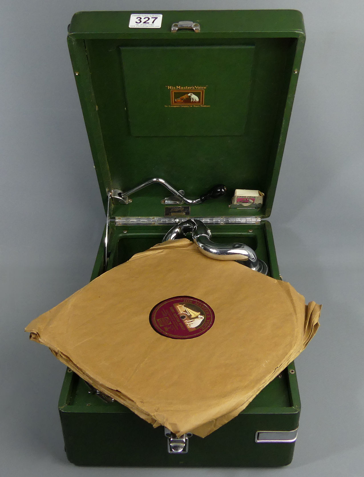 H.M.V green cased table top wind-up gramophone, retailed by Harods, with some 78's. UK Postage £20. - Image 6 of 6