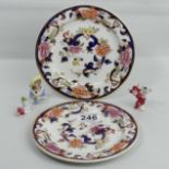 A pair of Mason's Ironstone Imari plates, two vintage bisque cake decorations and an Art Deco pin
