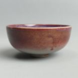 Chinese sang de bouef porcelain bowl with a peach design to the centre. 8 x 4 cm. UK Postage £12.