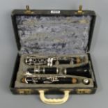 A Boosey & Hawkes cased clarinet in a fitted case. UK Postage £15.