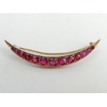 9ct gold faux ruby and diamond crescent form brooch, 2.9 grams. 50 mm. UK Postage £12.