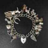 Sterling silver curb link charm bracelet, 70.5 grams. UK Postage £12.