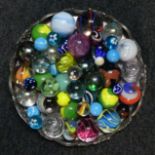 A silver plated tray of coloured various size marbles. UK Postage £15.