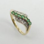 9ct gold emerald and diamond wave ring, 2 grams. Size O, 7.4 mm. UK Postage £12.