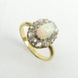 18ct gold opal and diamond oval cluster ring, 3.4 grams. Size L, 13.8 x 11.1 mm. UK Postage £12.