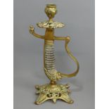 A sword handled Victorian brass candlestick, 25.5 cm. UK Postage £14.