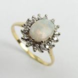 18ct gold opal and diamond cluster ring, 4.6 grams. Size W, 14.2 grams. UK Postage £12.