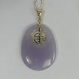 9ct gold and purple jade pendant and chain, 8.7 grams. 42 x 25 mm. UK Postage £12.