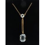 9ct gold Edna May pendant necklace, set pale blue stones, 3.9 grams. Pendant 43 mm long. UK