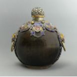 A Chinese large nut snuff bottle with white metal and enamel embellishment. 115 mm. UK Postage £12.
