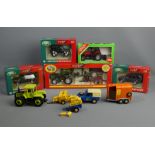 Four boxed Britains die-cast farm related vehicles, along with a boxed Silku tractor and other un-