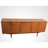 A stylish 1970's teak sideboard by Alfred Cox. 200 cm long x 80 high x 48 deep. Collection only.