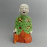 Chinese green and iron red glazed figure of Buddha, 147 mm. UK Postage £12.
