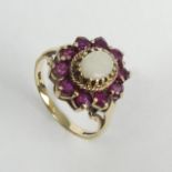 9ct gold opal and ruby ring, 3.5 grams. Size N 1/2, 15.8 mm. UK Postage £12.