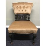 An Edwardian upholstered nursing chair on cabriolet legs. 49 x 72 cm. Collection only.