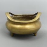 Chinese polished bronze twin handled censer, with impressed seal to the underside. 1320 grams, 17 cm