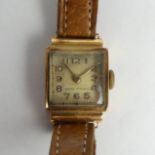 18ct gold ladies manual wind watch on a tan leather strap. UK Postage £12.