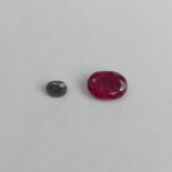 1.4 carat oval blue sapphire and a 6.6 carat oval ruby both certified. UK Postage £12.