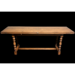 A good quality oak refectory table with extendable flaps and brass fitments. 185 cm x 50 cm (closed)