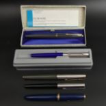 Boxed vintage Parker fountain pen, one other boxed and three further Parker pens. UK Postage £12.