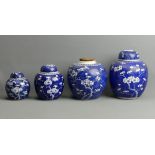 Four Chinese porcelain blue and white prunus decorated ginger jars, largest 21 cm. UK Postage £20.