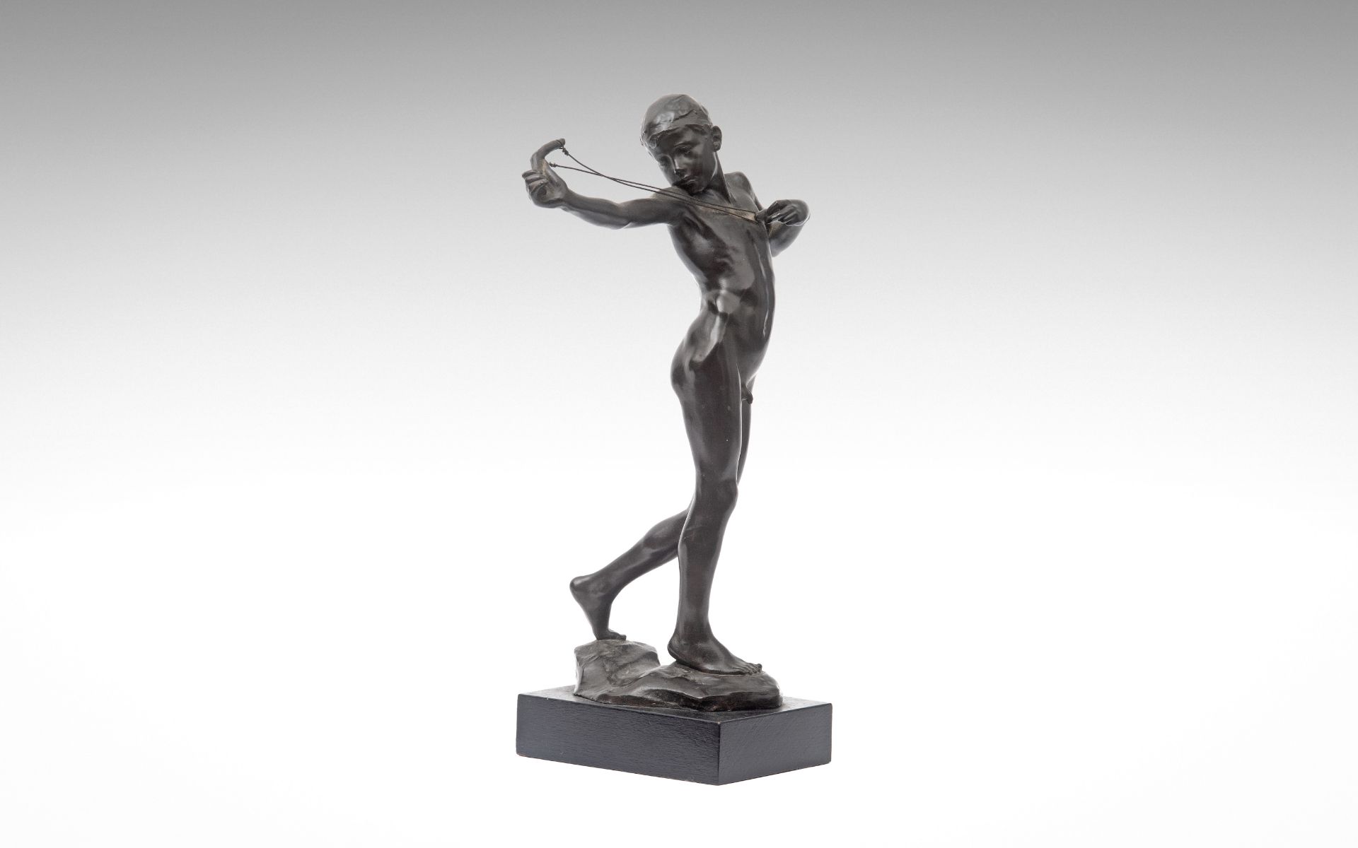 SIR WILLIAM REID DICK R.A. (BRITISH, 1879-1961): A RARE BRONZE FIGURE OF 'SLING BOY'